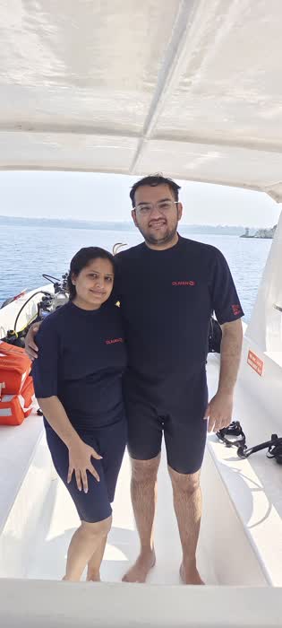 Two divers standing on the dive boat before heading out